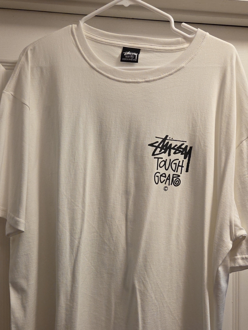 Stussy White Short-Sleeve Tee with Black Chest Graphic